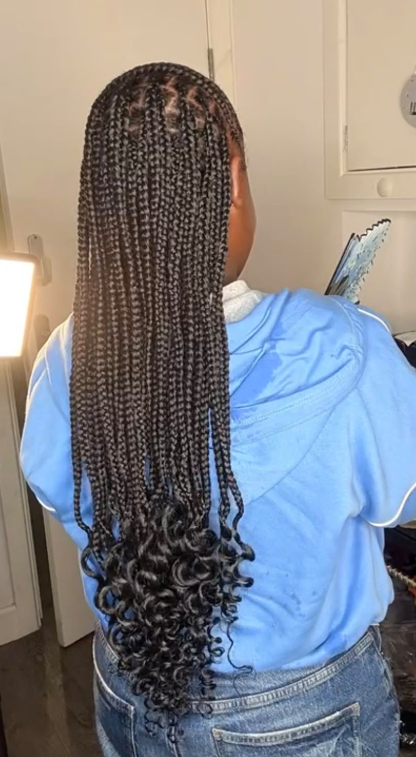 Medium knotless braids with curly ends, waist length