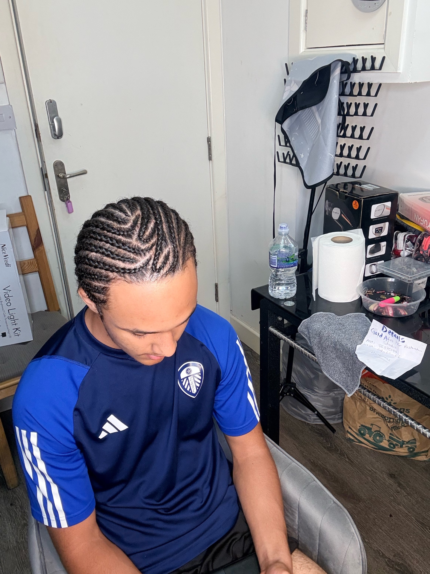 Men's flat twist cornrows with clean, curved partings