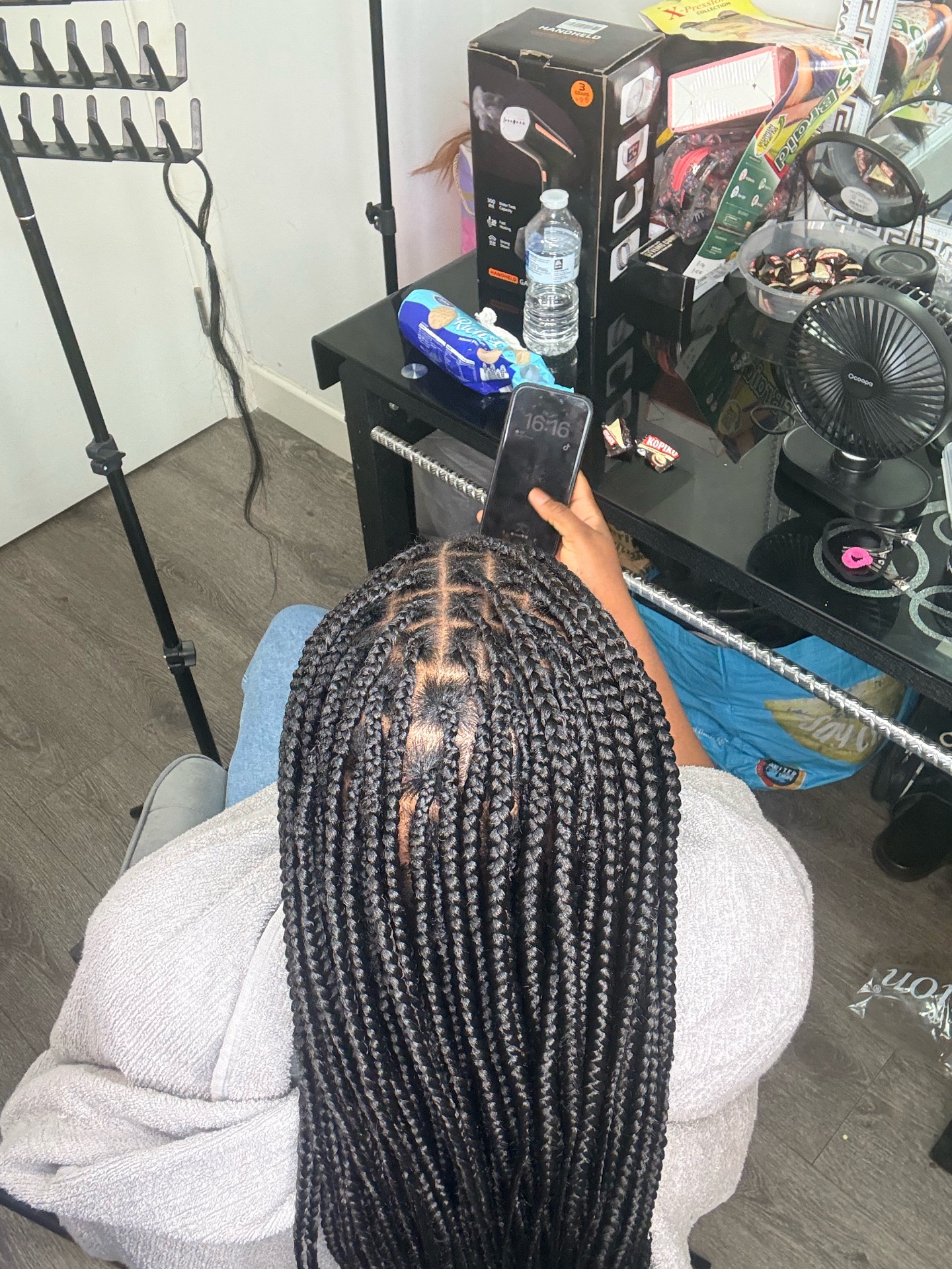 Medium box braids with neat square partings styled at the Leeds studio