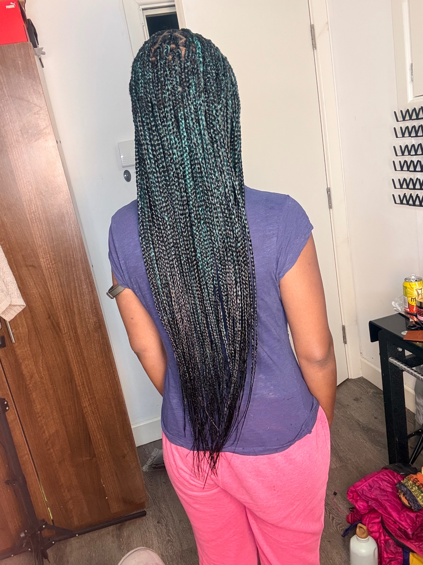 Long box braids with teal tones styled at the Leeds studio