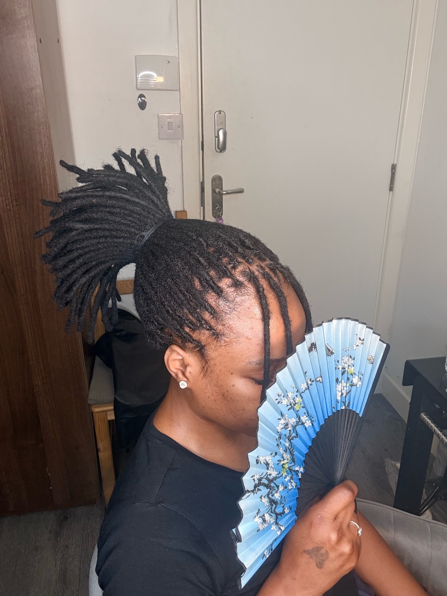 Neat loc retwist styled into a high ponytail