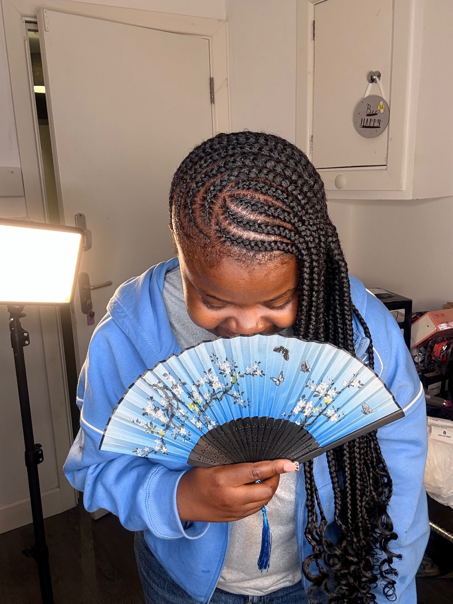 Side-swept lemonade braids with curly ends styled at the Leeds studio